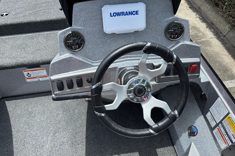 Slide: The Image of Steering console of a 2026 Nitro Z18 boat with Lowrance electronics. - 13