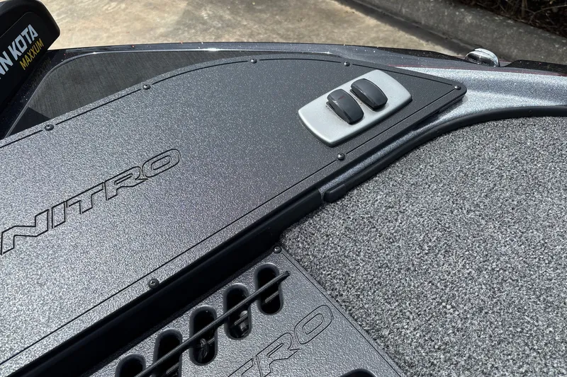 Slide: The Image of 2026 Nitro Z18 boat deck with control switches and textured surface. - 9