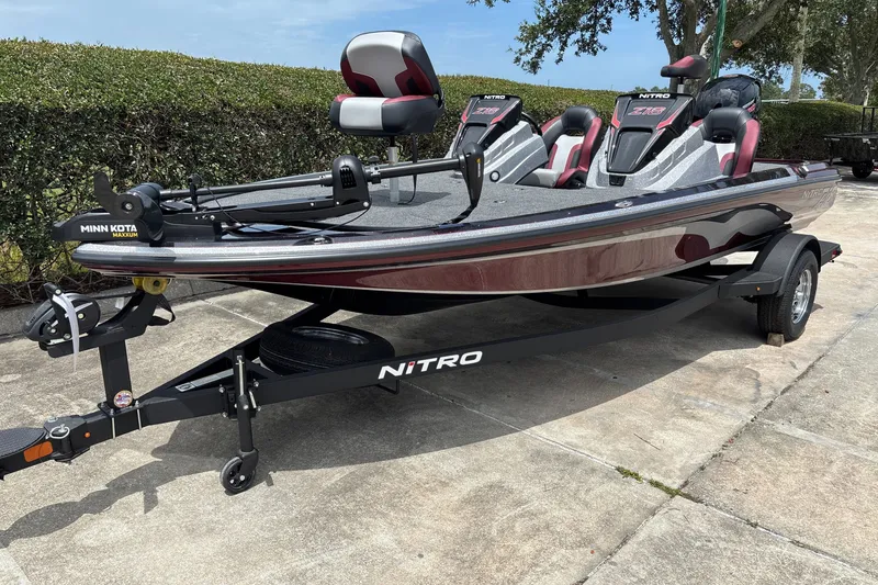 Slide: The Image of 2026 Nitro Z18 fishing boat with Minn Kota Maxxum trolling motor on trailer. - 1