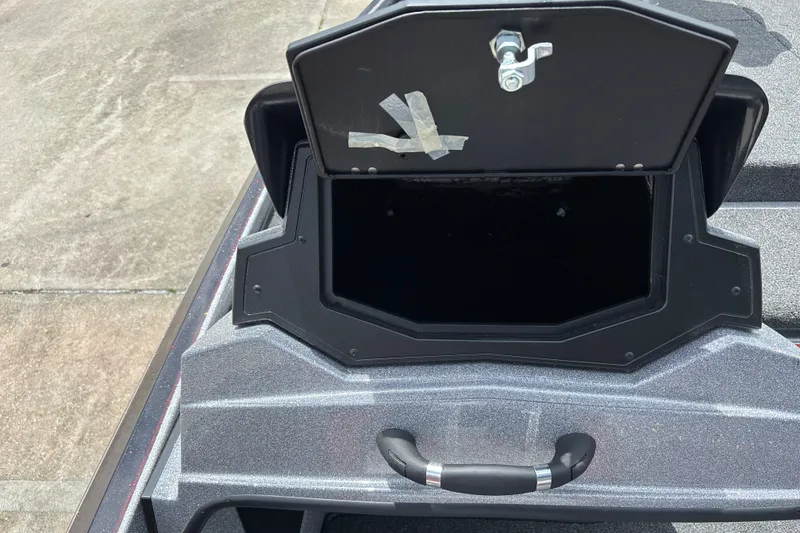 Slide: The Image of An open storage compartment on a boat with a handle below. - 20