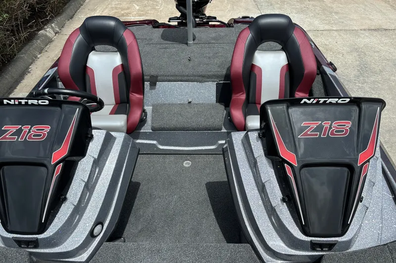 Slide: The Image of 2026 Nitro Z18 boat interior with dual seats and sleek design. - 11