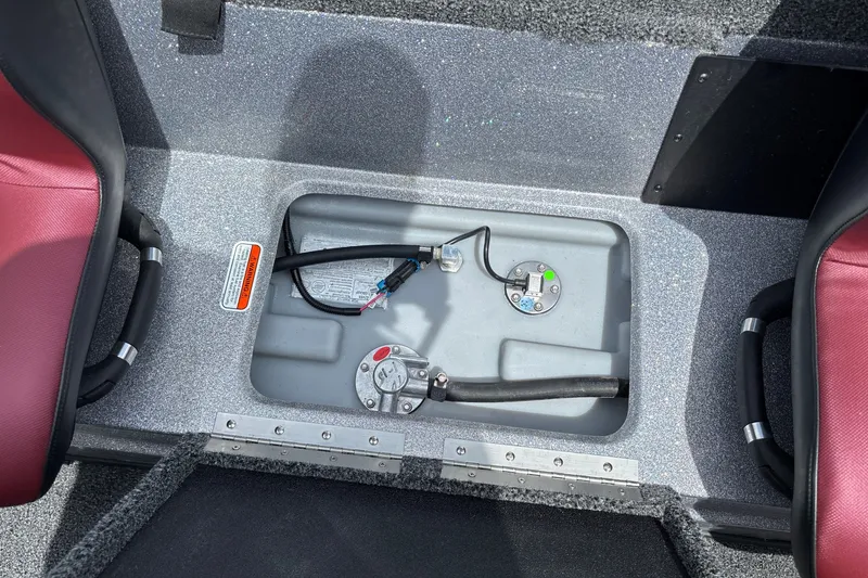 Slide: The Image of Fuel compartment of a 2026 Nitro Z18 boat with visible hoses and fittings. - 25