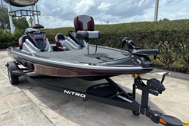 Slide: The Image of 2026 Nitro Z18 boat on trailer, sleek design, parked outdoors under cloudy sky. - 5