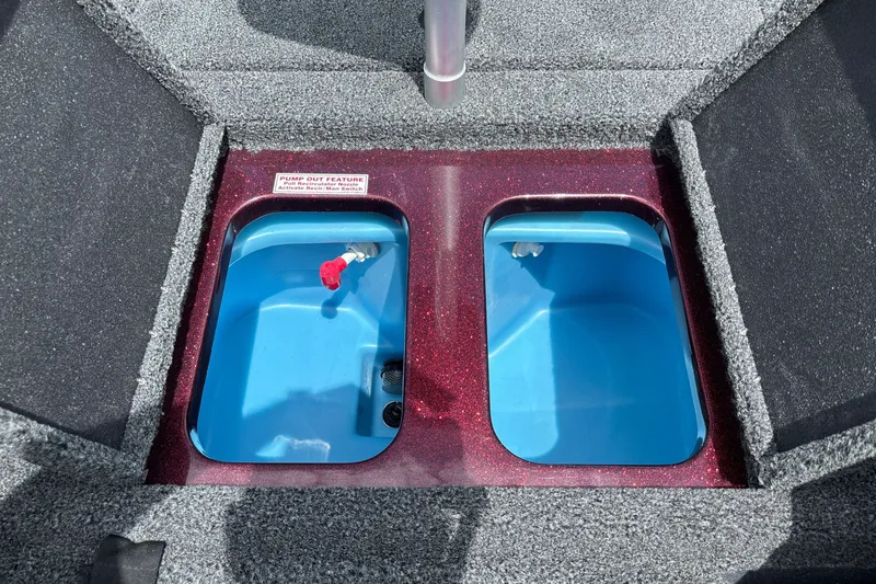 Slide: The Image of Livewell compartments in a 2026 Nitro Z18 boat, featuring blue interiors and pump-out feature. - 26