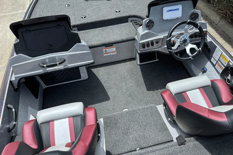 Slide: The Image of Interior of a 2026 Nitro Z18 boat featuring dual seats and a steering console. - 12