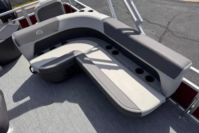 Slide: The Image of 2026 Sun Tracker Bass Buggy 18 DLX boat seating with cup holders, gray upholstery. - 11