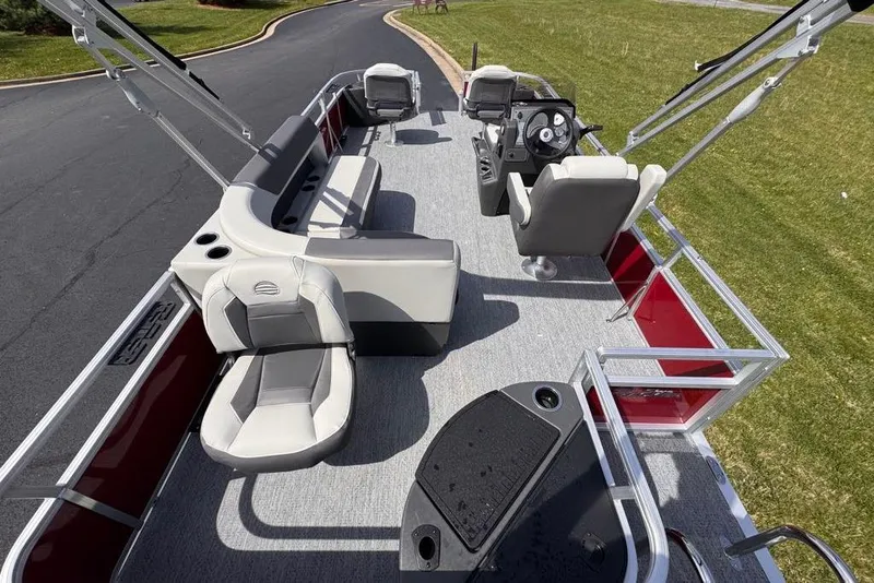 Slide: The Image of 2026 Sun Tracker Bass Buggy 18 DLX pontoon boat with spacious seating and modern design. - 13