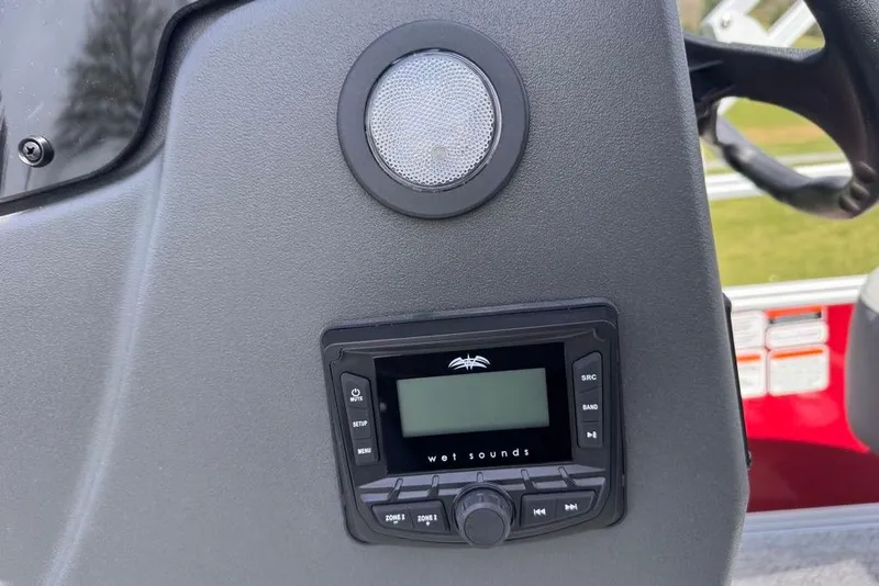 Slide: The Image of 2026 Sun Tracker Bass Buggy 18 DLX dashboard with Wet Sounds audio system. - 15