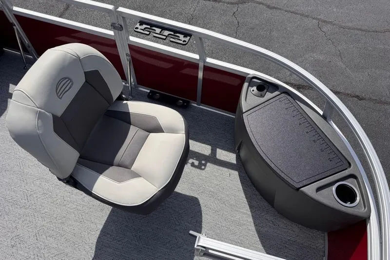 Slide: The Image of 2026 Sun Tracker Bass Buggy 18 DLX boat interior with seating and storage. - 8