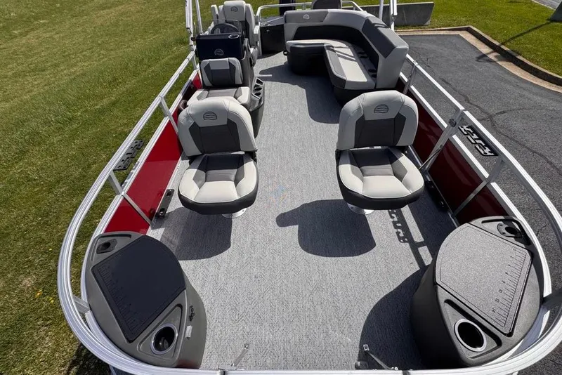Slide: The Image of 2026 Sun Tracker Bass Buggy 18 DLX pontoon boat interior with seating and storage. - 9
