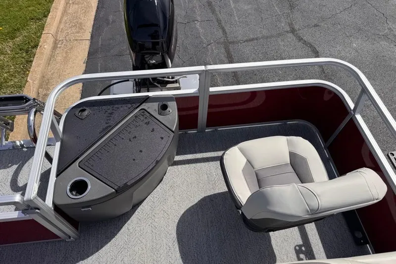 Slide: The Image of 2026 Sun Tracker Bass Buggy 18 DLX boat interior with seating and control panel. - 93