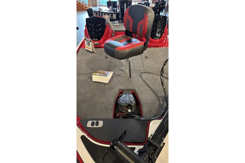 Slide: The Image of 2026 Nitro Z17 boat interior with red and black seating, carpeted deck, and equipment. - 3