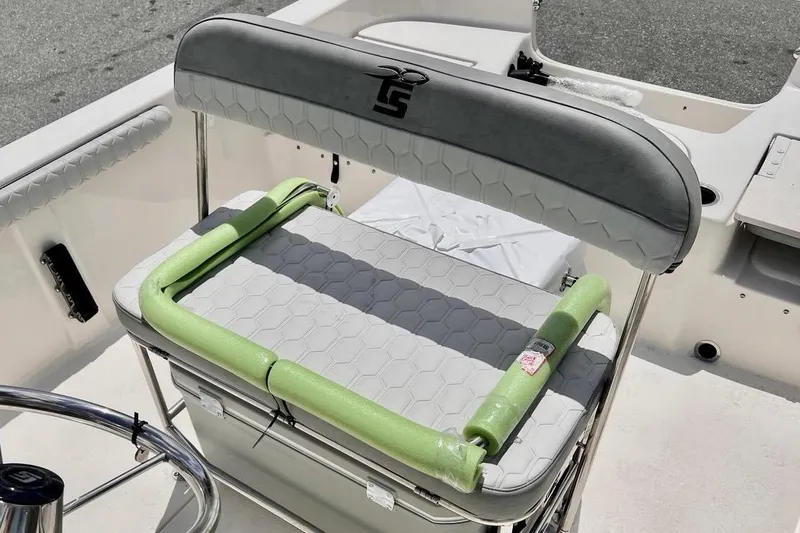 Slide: The Image of 2026 Carolina Skiff 19 LS boat seat with green pool noodle for added comfort. - 4