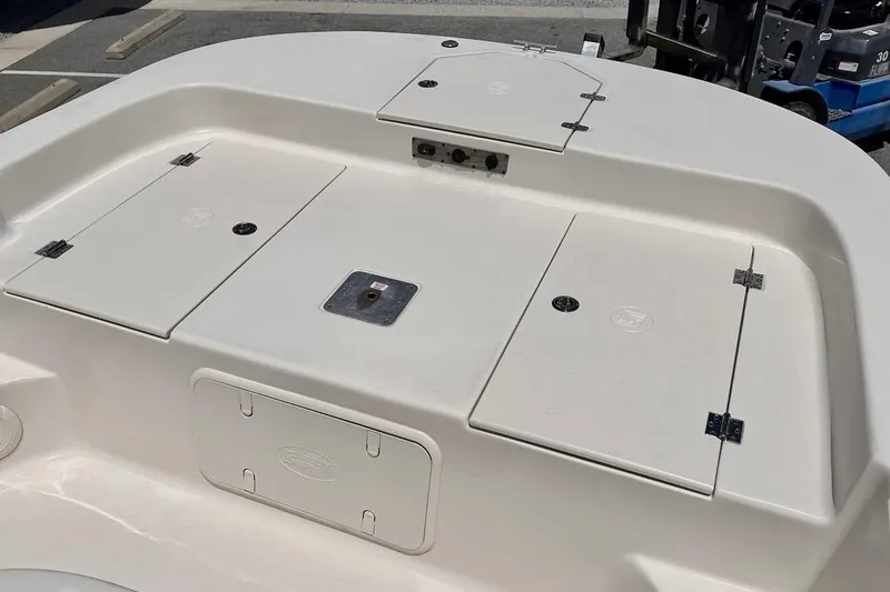 Slide: The Image of 2026 Carolina Skiff 19 LS boat deck with storage compartments and clean design. - 6