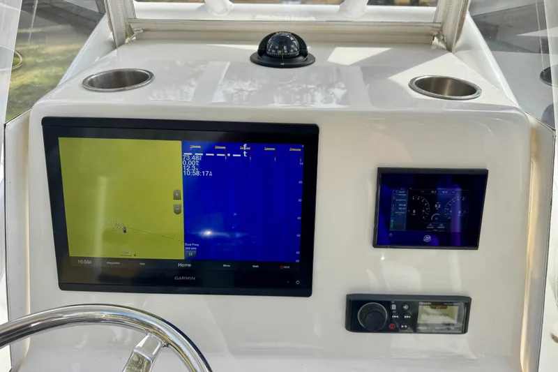 Slide: The Image of Dashboard of 2021 ZCB 26 Freemason boat with navigation and control screens. - 15