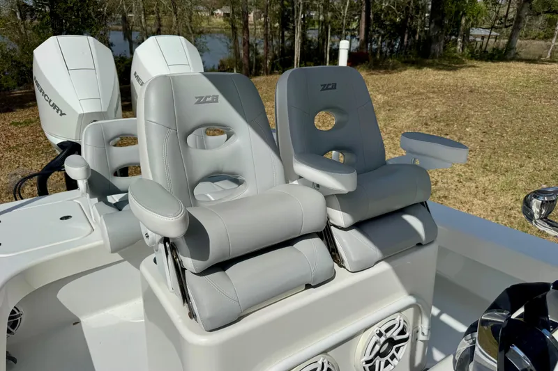 Slide: The Image of Luxury seating on 2021 ZCB 26 Freemason boat with dual Mercury engines. - 18