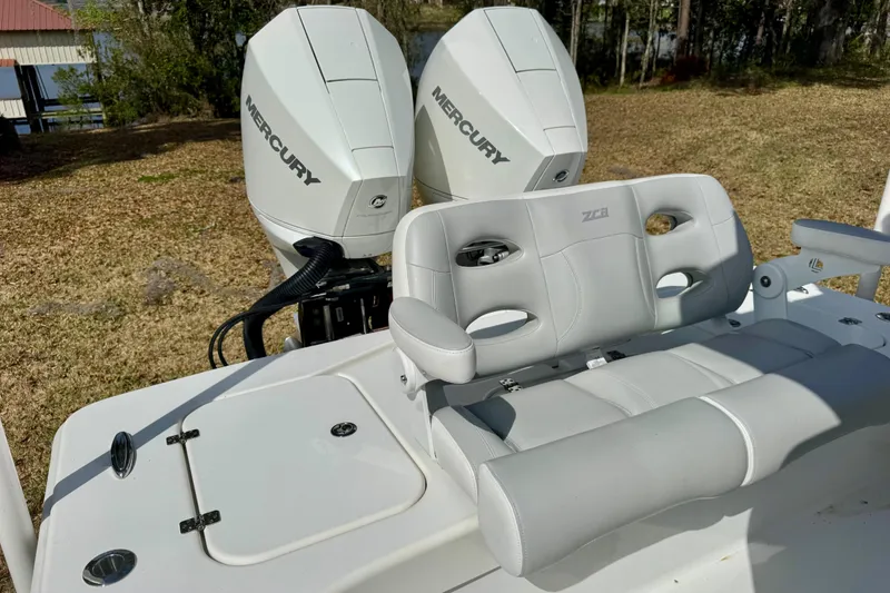Slide: The Image of 2021 ZCB 26 Freemason boat with dual Mercury engines and cushioned seating. - 19