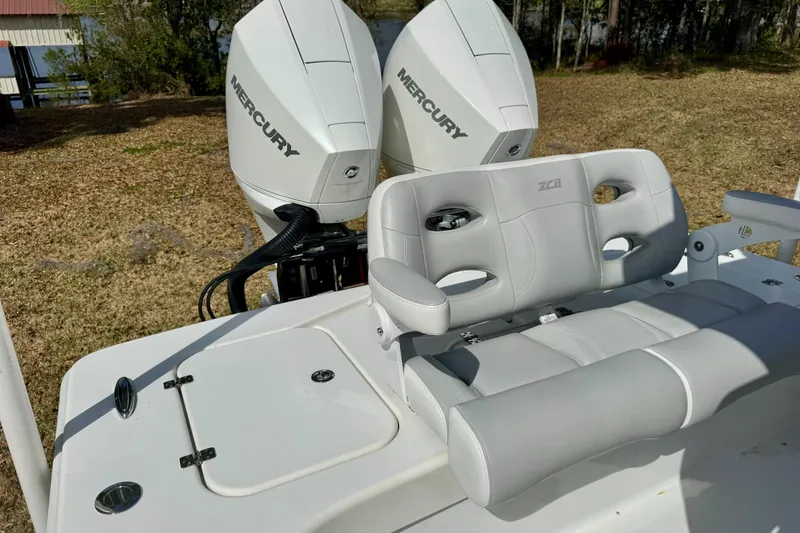 Slide: The Image of 2021 ZCB 26 Freemason boat with dual Mercury engines and cushioned seating. - 20