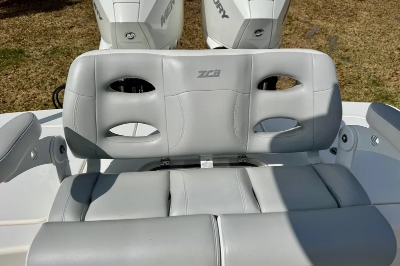 Slide: The Image of 2021 ZCB 26 Freemason boat seat with gray upholstery and dual Mercury engines. - 22