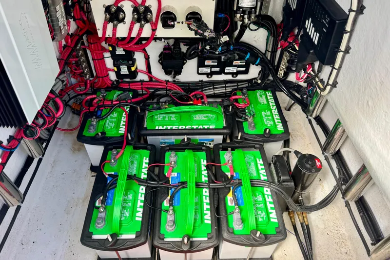 Slide: The Image of Battery compartment of 2021 ZCB 26 Freemason with Interstate batteries and wiring. - 24