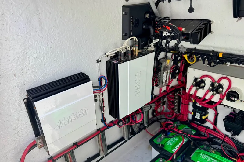 Slide: The Image of Audio system installation with amplifiers and wiring in a 2021 ZCB 26 Freemason boat. - 25