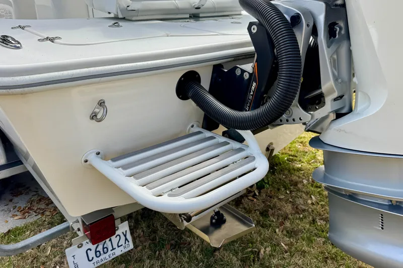 Slide: The Image of 2021 ZCB 26 Freemason boat stern with swim platform and motor details. - 6