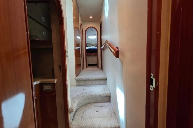 Slide: The Image of Interior hallway of 2008 Neptunus Flybridge MY yacht with carpeted stairs and wooden accents. - 104
