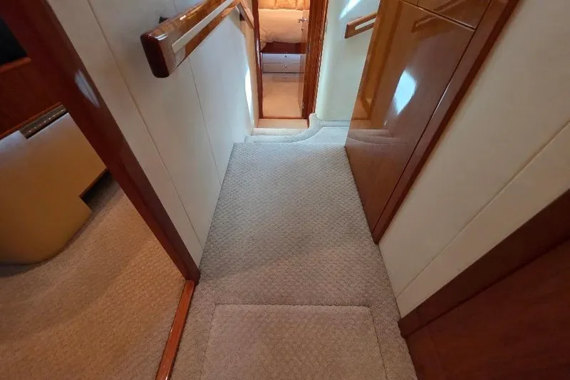 Slide: The Image of Interior hallway of 2008 Neptunus Flybridge MY yacht with carpeted flooring and wooden accents. - 107