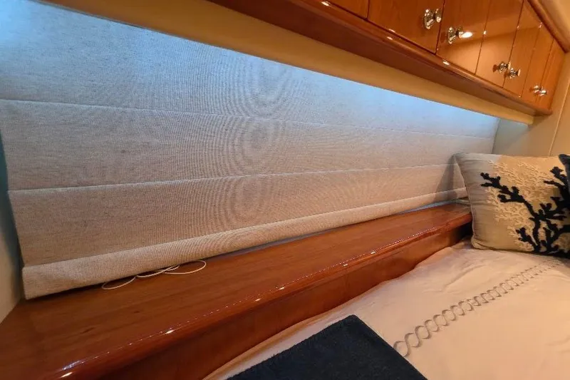 Slide: The Image of Luxurious interior of 2008 Neptunus Flybridge MY with elegant wood finish and plush bedding. - 120