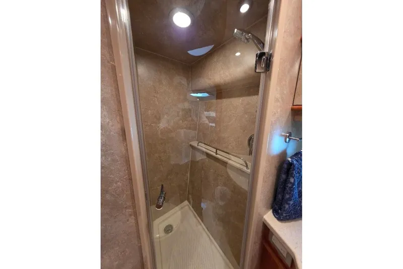 Slide: The Image of Shower area in 2008 Neptunus Flybridge MY yacht with glass door and beige interior. - 128