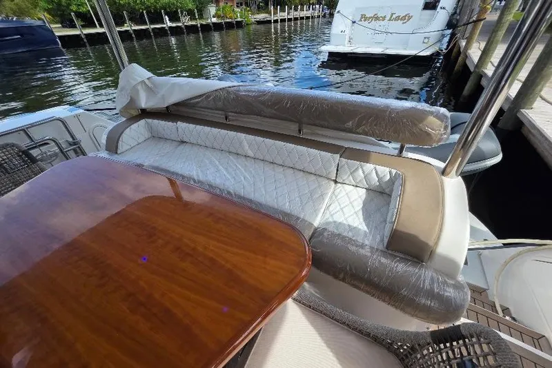 Slide: The Image of Luxurious seating area on a 2008 Neptunus Flybridge MY yacht, docked by the water. - 13