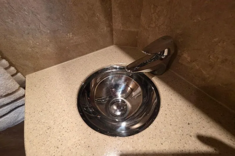 Slide: The Image of Stainless steel sink and faucet in Neptunus Flybridge MY 2008 yacht bathroom. - 135