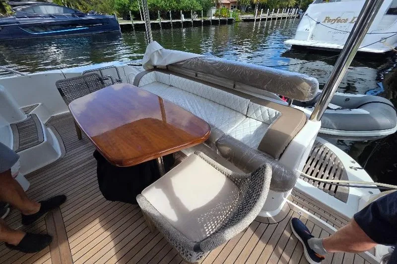 Slide: The Image of Luxury Neptunus Flybridge MY 2008 yacht deck with elegant seating and wooden table. - 14