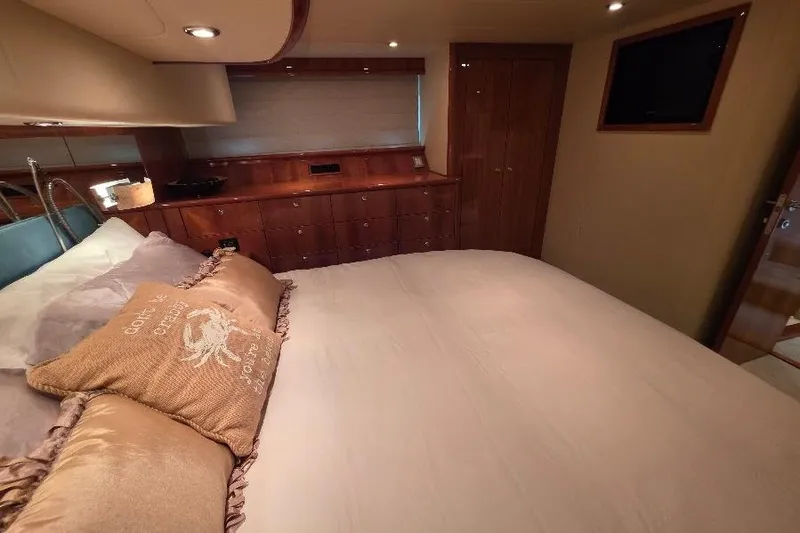 Slide: The Image of Luxurious bedroom interior of 2008 Neptunus Flybridge MY yacht with elegant wood finishes. - 142