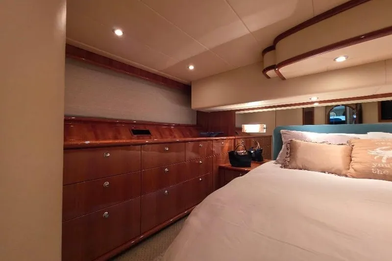 Slide: The Image of Luxurious bedroom interior of 2008 Neptunus Flybridge MY yacht with elegant wood cabinetry. - 147