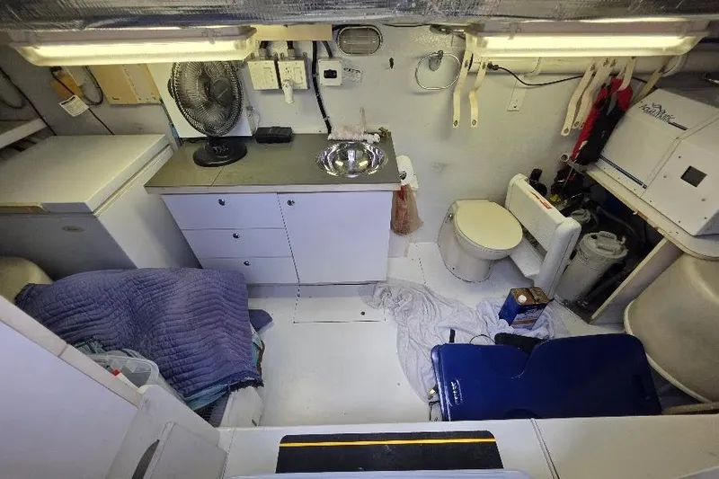 Slide: The Image of 2008 Neptunus Flybridge MY yacht interior with kitchenette, sink, and toilet. - 163