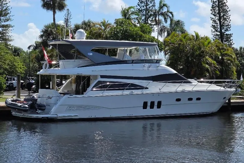 Slide: The Image of 2008 Neptunus Flybridge MY yacht docked by lush greenery and calm waters. - 174