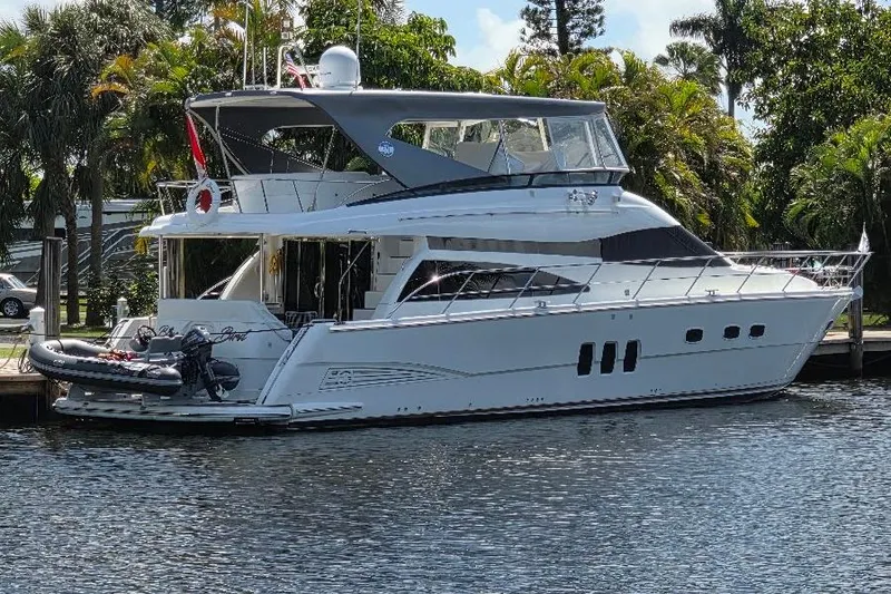 Slide: The Image of Luxury 2008 Neptunus Flybridge MY yacht docked by lush greenery. - 3