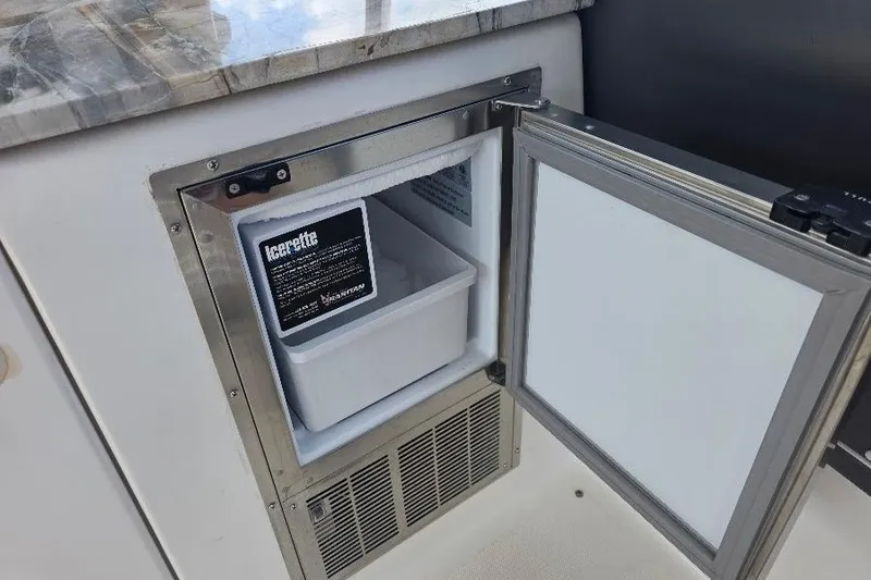 Slide: The Image of Open ice maker on 2008 Neptunus Flybridge MY yacht, featuring stainless steel finish. - 30