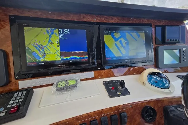 Slide: The Image of Control panel of 2008 Neptunus Flybridge MY with navigation screens and instruments. - 32
