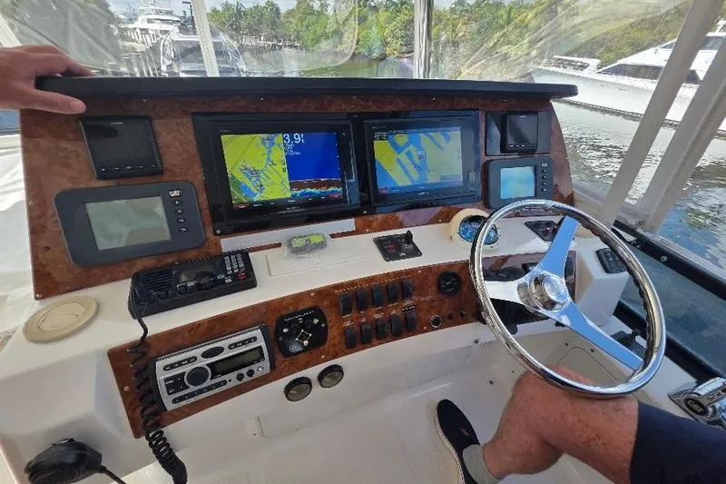 Slide: The Image of Helm of 2008 Neptunus Flybridge MY with navigation screens and controls. - 33