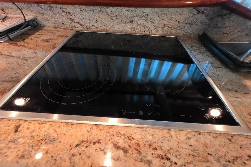 Slide: The Image of Modern stovetop on Neptunus Flybridge MY 2008 yacht's granite countertop. - 61