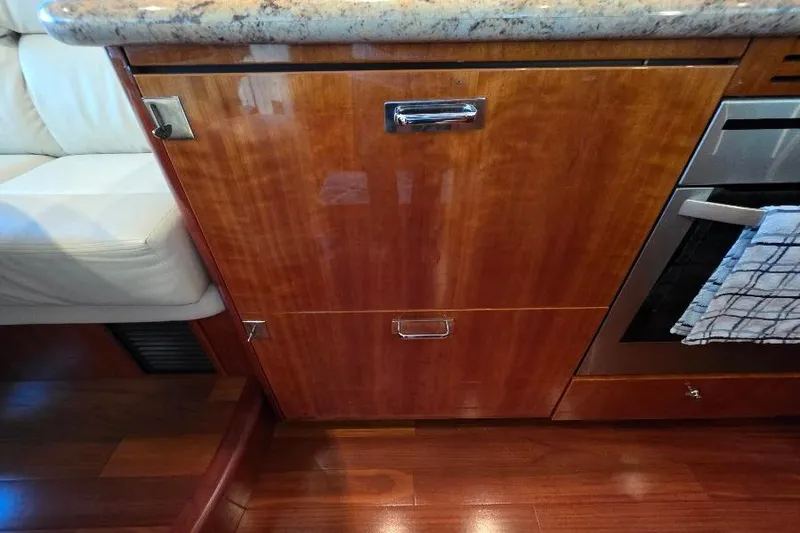 Slide: The Image of Wooden cabinetry and granite countertop in 2008 Neptunus Flybridge MY yacht kitchen. - 66