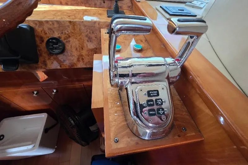 Slide: The Image of Control panel of a 2008 Neptunus Flybridge MY yacht with dual throttle levers. - 71