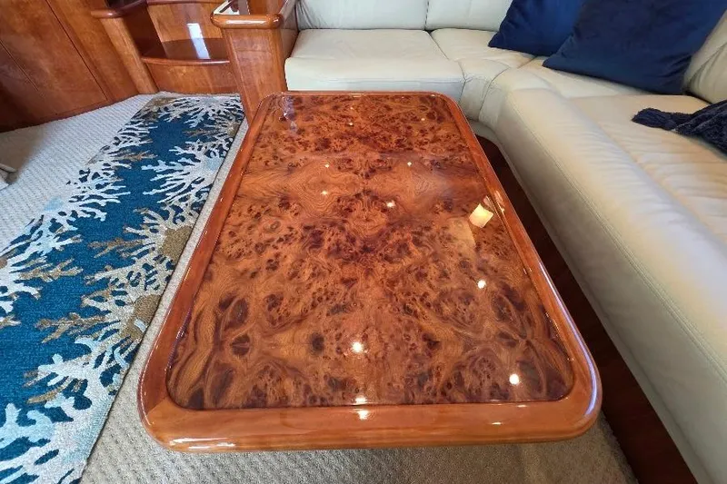 Slide: The Image of Luxurious wooden table on Neptunus Flybridge MY 2008 yacht, surrounded by elegant seating. - 90