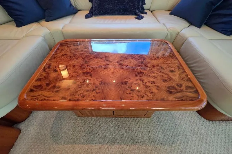 Slide: The Image of Luxurious wooden table on Neptunus Flybridge MY 2008 yacht, surrounded by beige seating. - 91