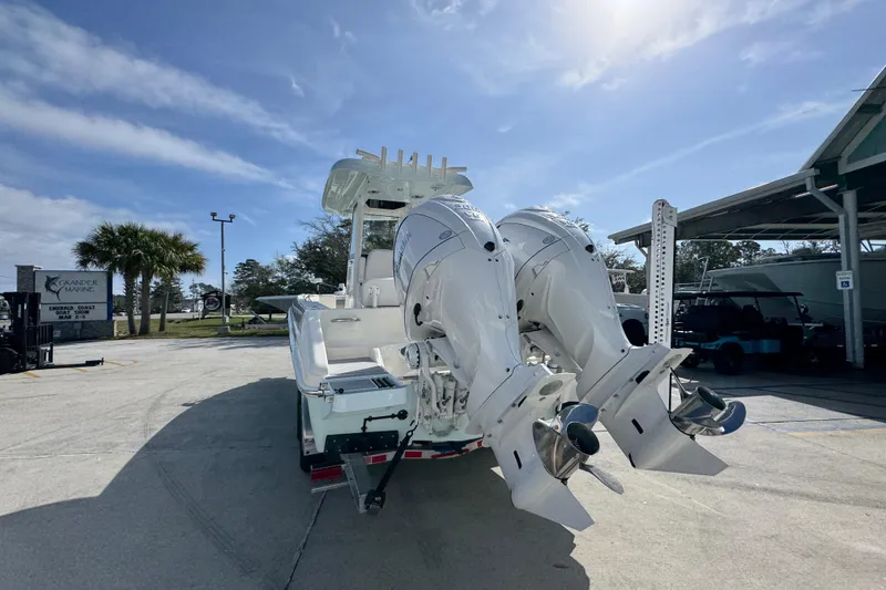 Slide: The Image of 2026 Blackwood 270 LXF boat with dual outboard engines at a marina. - 14