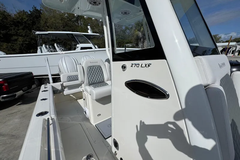 Slide: The Image of 2026 Blackwood 270 LXF boat with luxurious seating and sleek design. - 25
