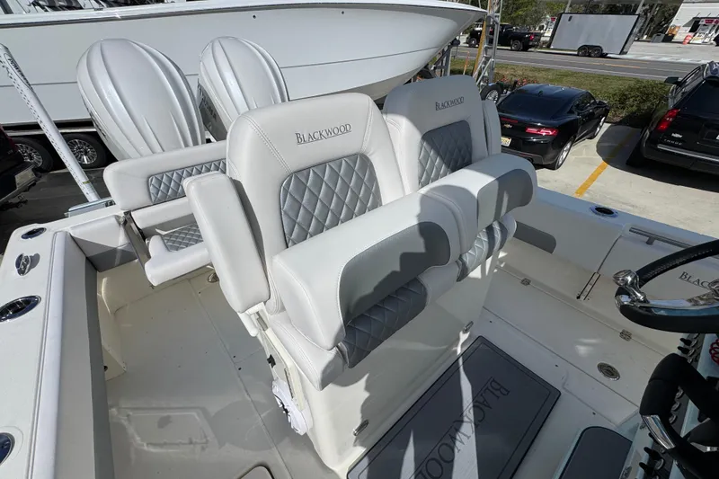 Slide: The Image of 2026 Blackwood 270 LXF boat interior with luxury seating and steering wheel. - 29