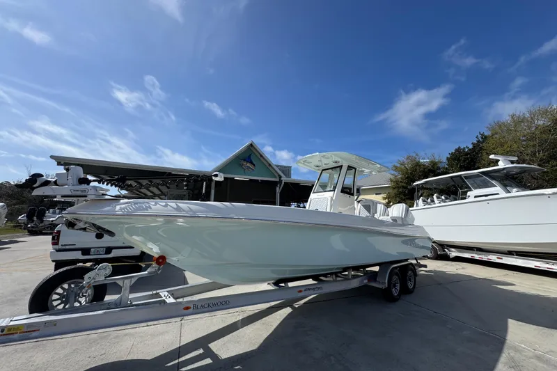 Slide: The Image of 2026 Blackwood 270 LXF boat on trailer under clear blue sky. - 3